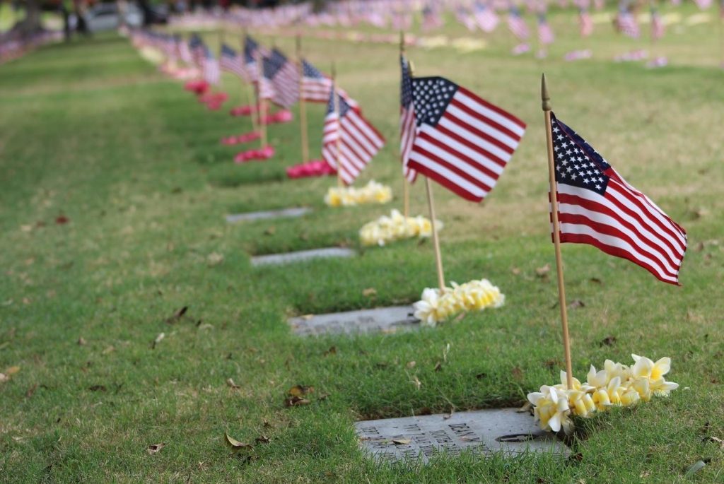Flags adorn grave sites at the National Memorial Cemetery of the Pacific.