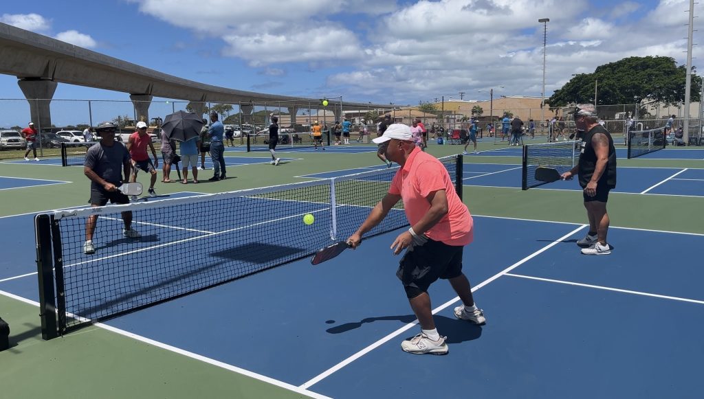 Pickleball players playing on the newly-opened pickleball courts at Ke'ehi Lagoon