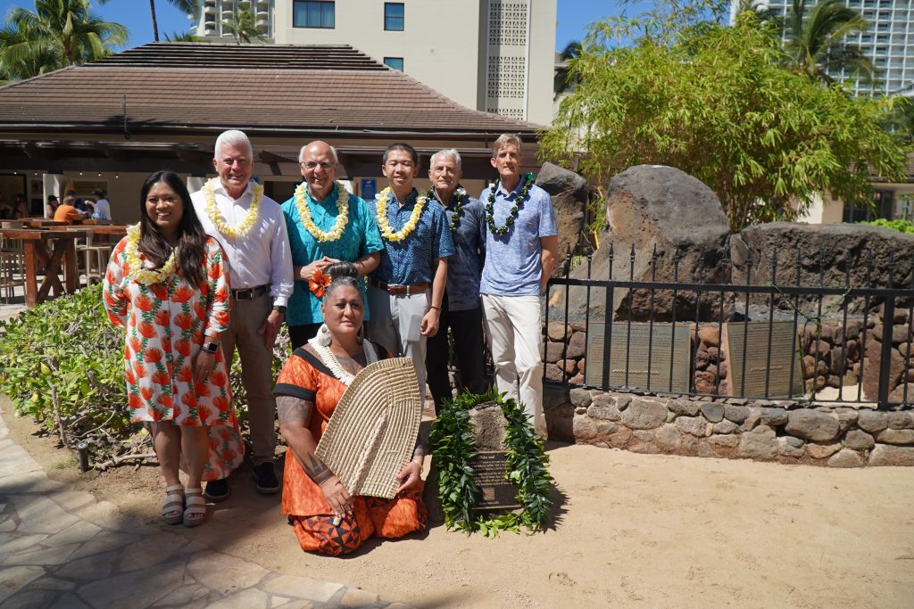 Honolulu Mayor Rick Blangiardi, Managing Director Mike Formby and those who spearheaded the project to install an informational plaque at Kapaemahu stones pose for a photo. 