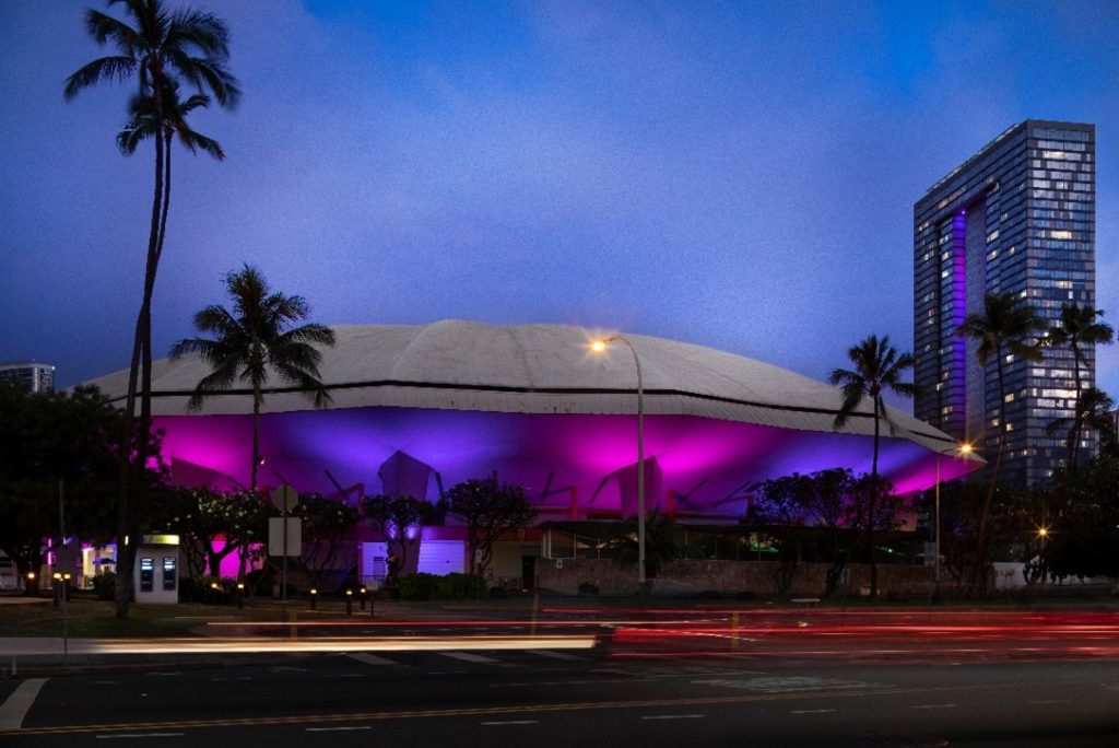 The Blaisdell Center Arena illuminated in the evening. 