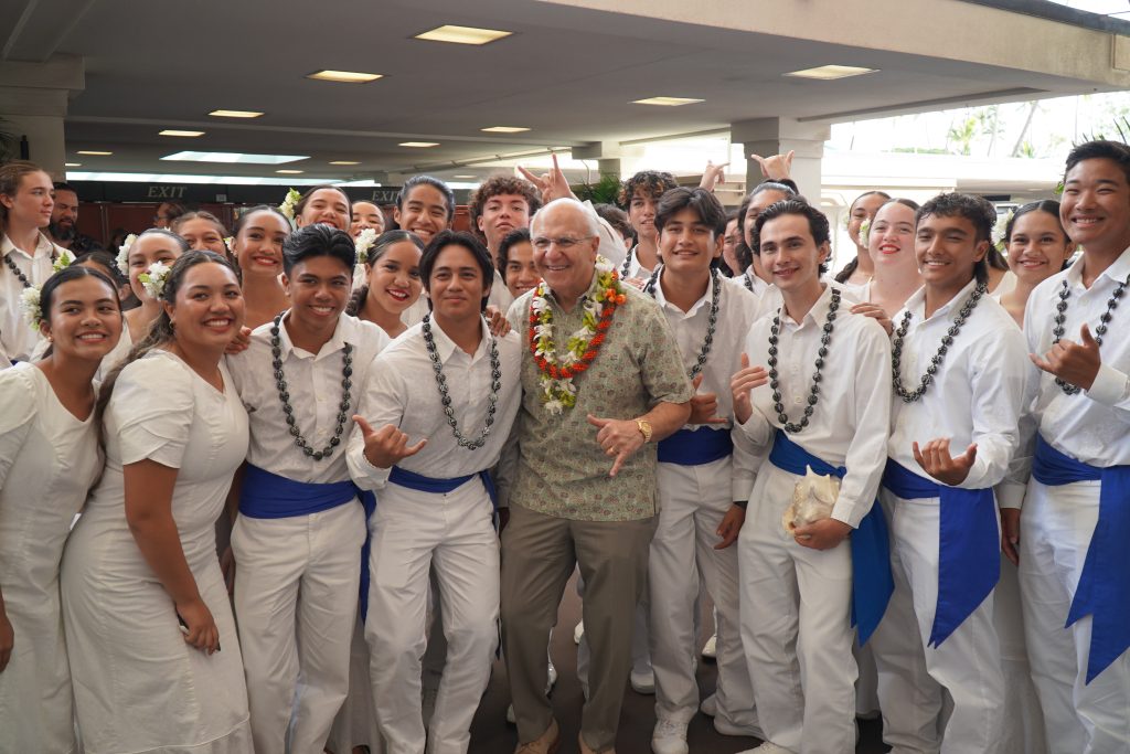 Mayor Rick Blangiardi takes a photo with the Kamehameha Schools Concert Glee Club 